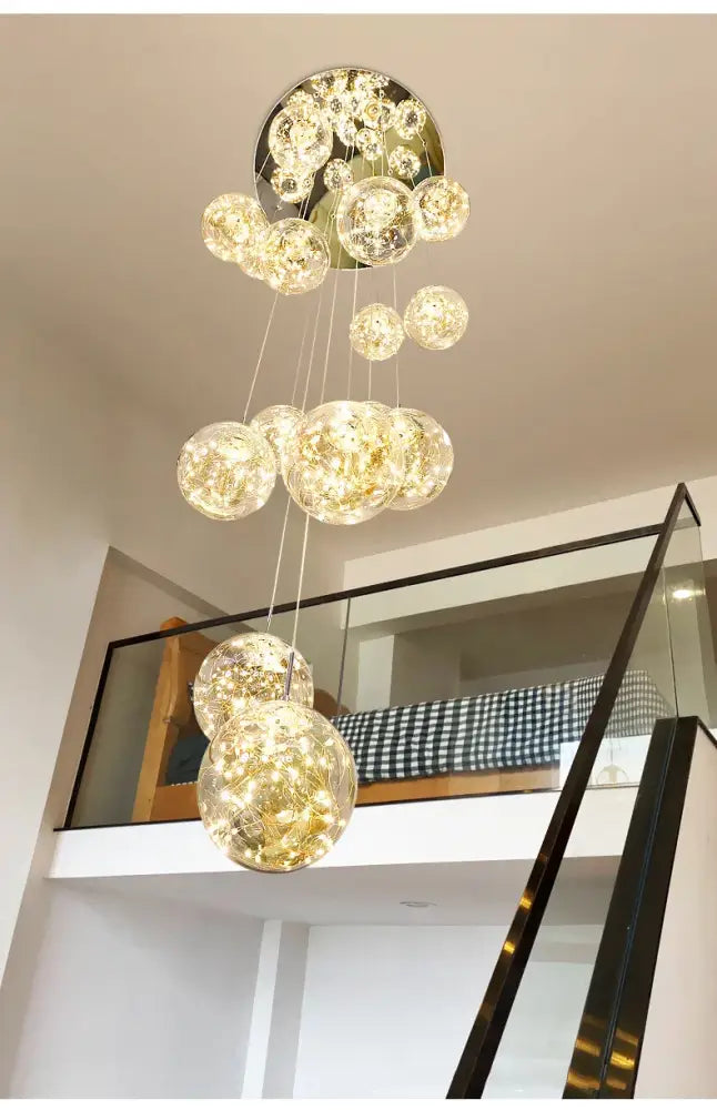 DecorBites™ spiral crystal ball chandelier light with gold-toned base and warm glass orbs emitting golden light