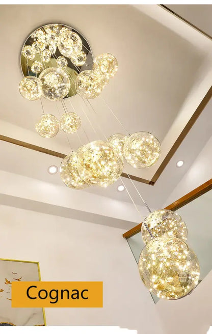 A modern DecorBites™ spiral crystal ball chandelier light with multiple glass orbs and internal led lighting suspended from a metallic base