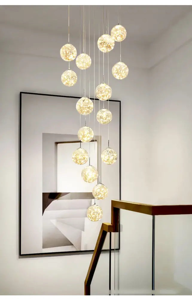 Decorbites spiral crystal ball chandelier light with cascading glass orbs emitting warm golden glow free shipping