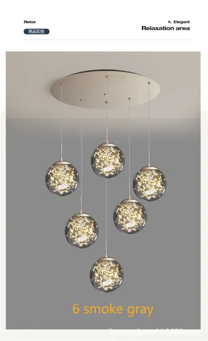 Six smoke gray spherical glass pendant lights hang from a circular ceiling fixture in a decorbites crystal ball chandelier