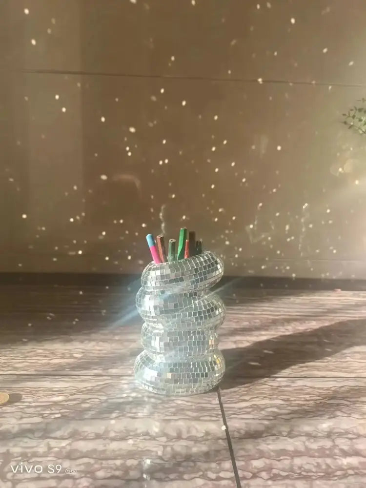 Decorbites spiral mosaic vase is a silver reflective plastic spiral vase for creative flower arrangements