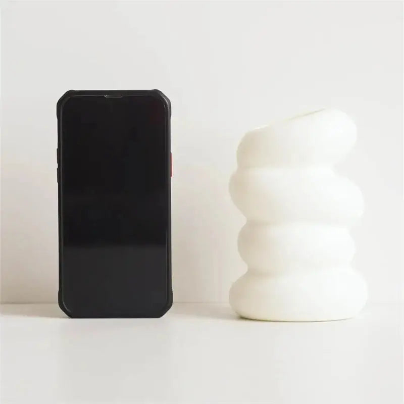 White ceramic spiral white vase with stacked rounded segments for home decor by DecorBites