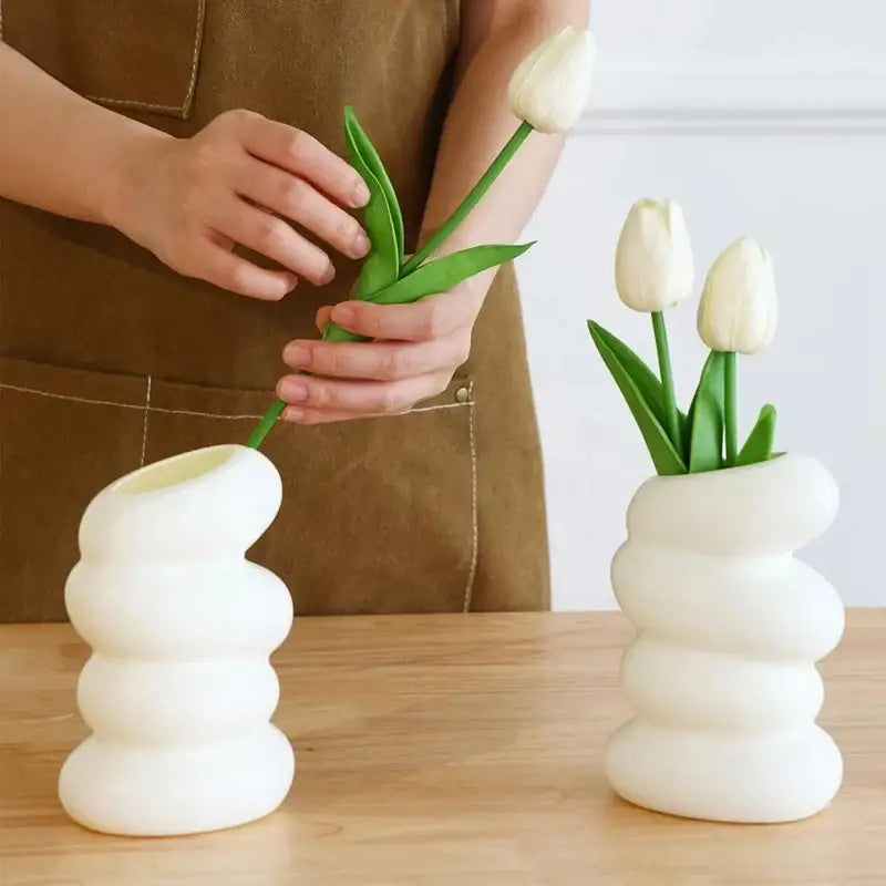 DecorBites spiral white vase made of glossy ceramic with a modern stacked-ringed design for home decor