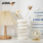 White ceramic spiral white vase with stacked rounded ridges and smooth finish for home decoration by DecorBites