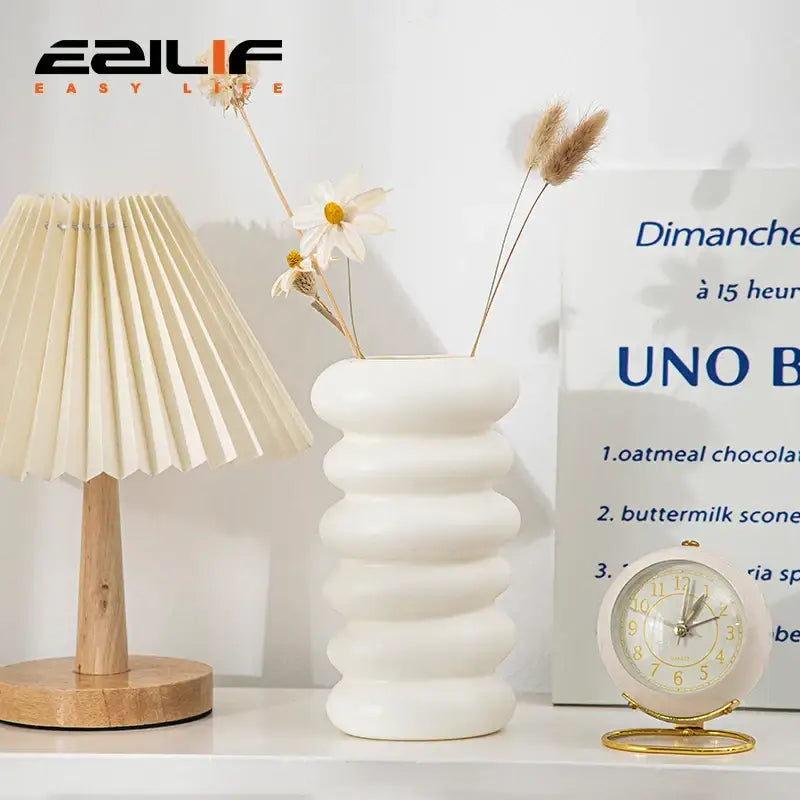 White ceramic spiral white vase with stacked rounded ridges and smooth finish for home decoration by DecorBites