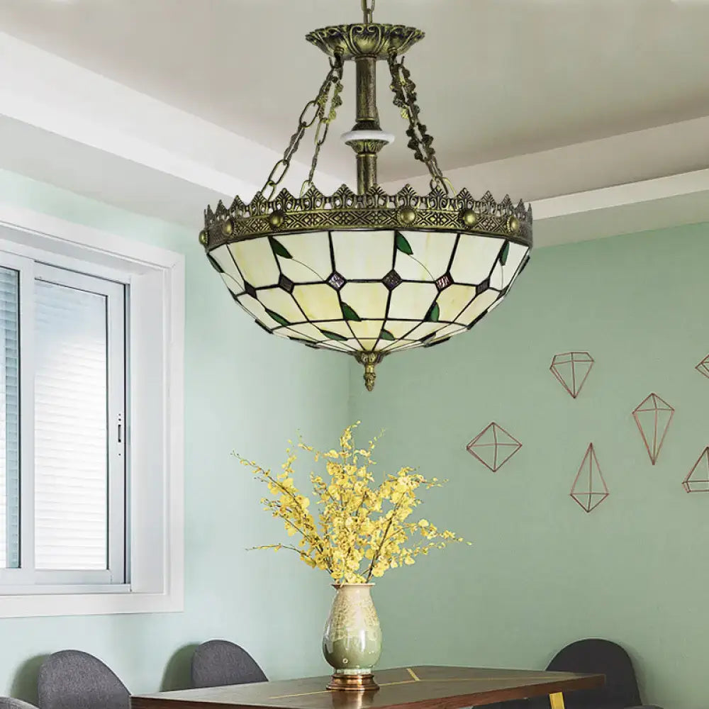Decorbites stained glass bowl pendant light with antique brass finish and lodge leaf geometric cream and green panels