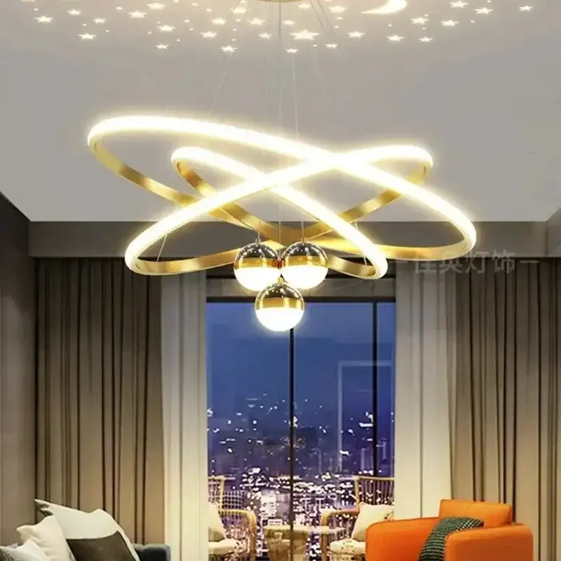 Gold-toned DecorBites™ Starry Sky led chandelier with intertwined rings and spherical lights for living room decor