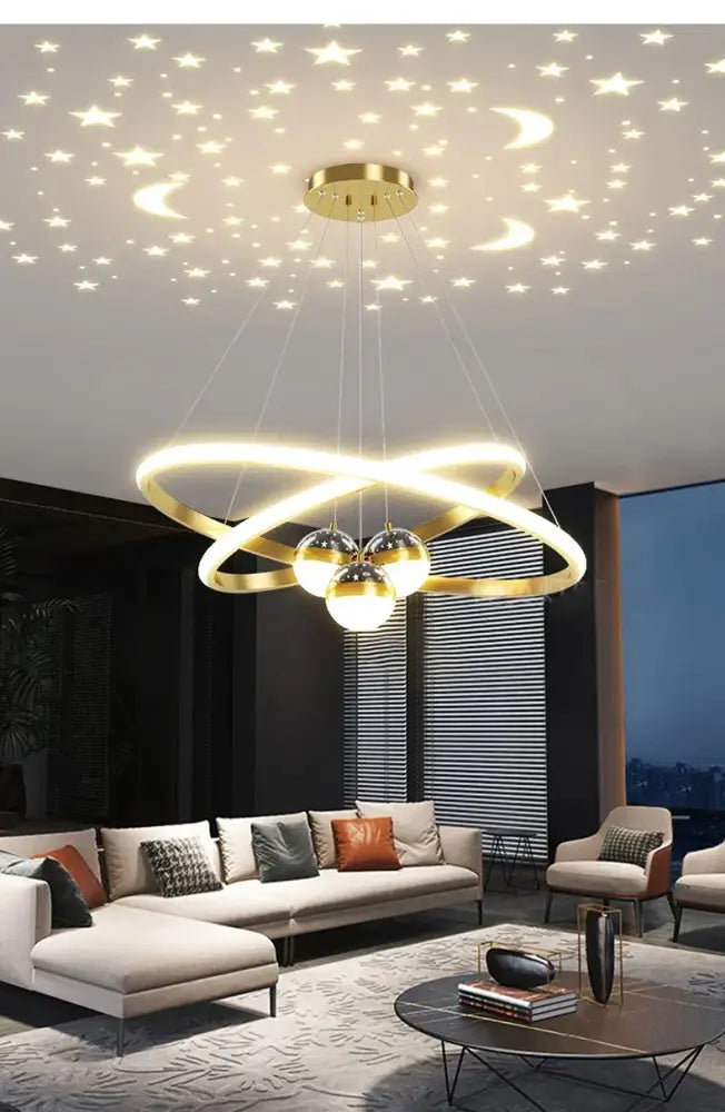 Gold-toned decorbites starry sky led chandelier with intertwined rings and three bulbs for living room lighting