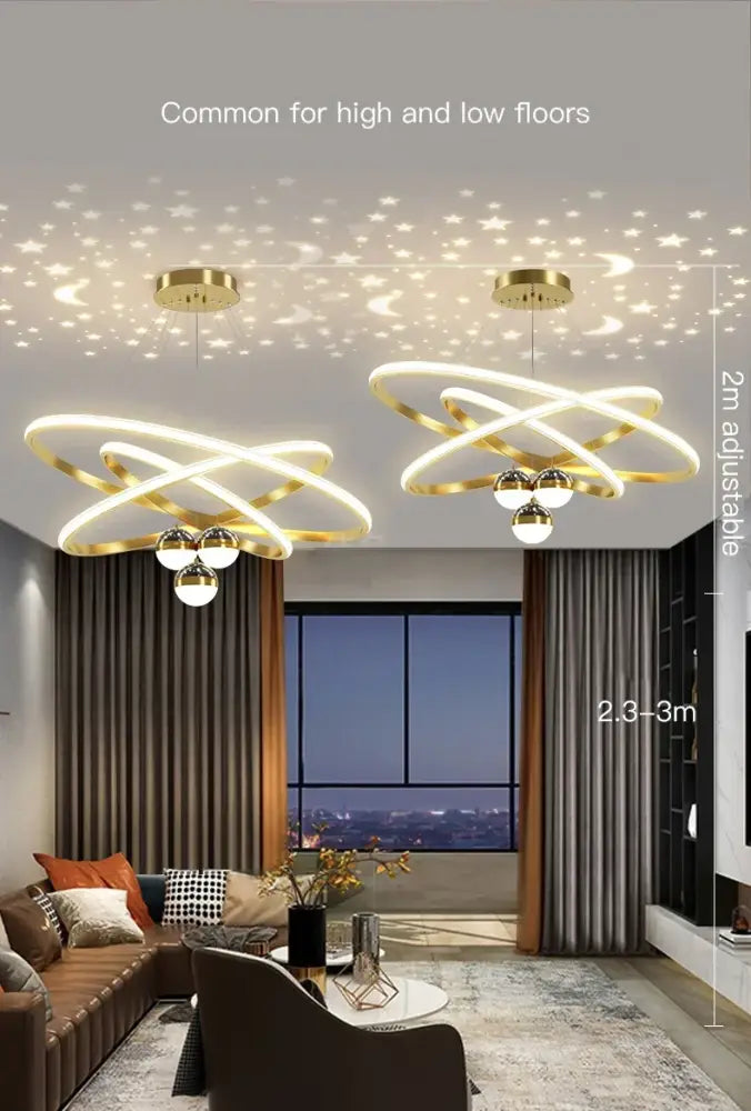 Gold-toned modern led chandelier with intertwined circular rings and spherical bulbs for living room starry sky decor