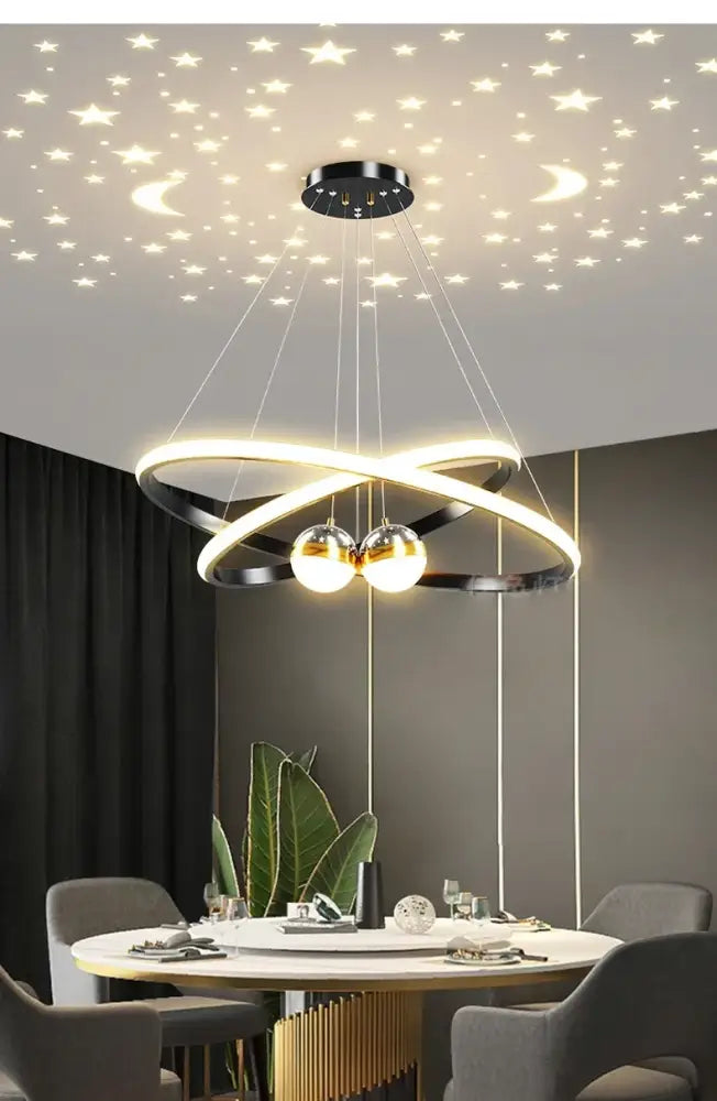 Modern black and gold led chandelier with intertwined rings and spherical bulbs for living room starry sky decor