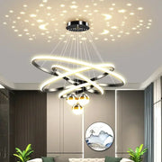 Modern black and gold led chandelier with interlocking rings and spherical lights for living room starry sky decor