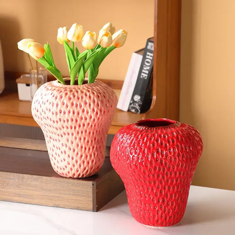 A vibrant red DecorBites™ strawberry cartoon ceramic vase with a textured surface for kids room decor