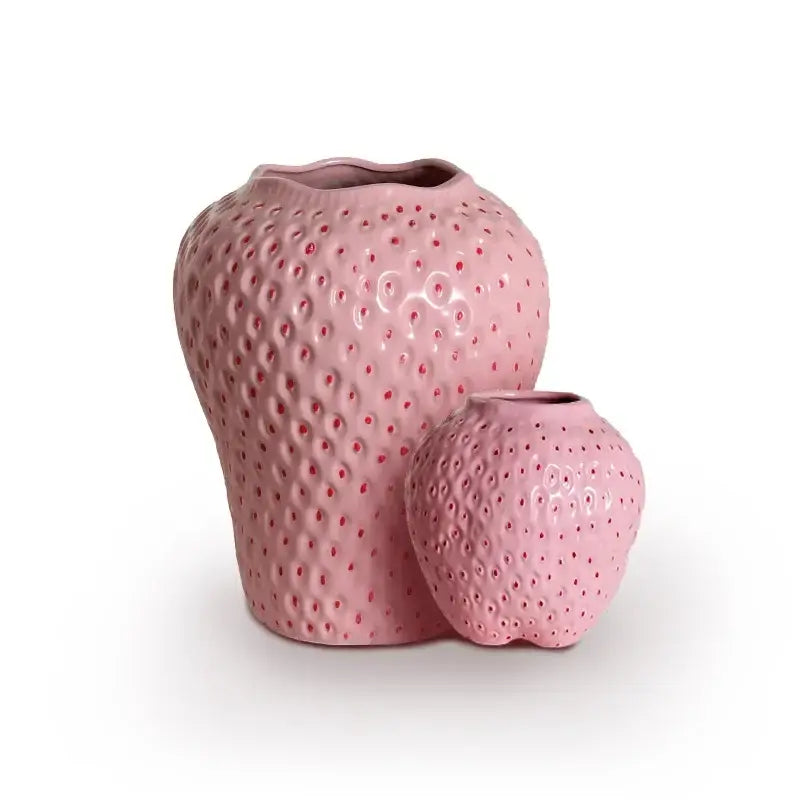 Pink ceramic cartoon strawberry flower vase with textured surface and red seed details for home décor by DecorBites