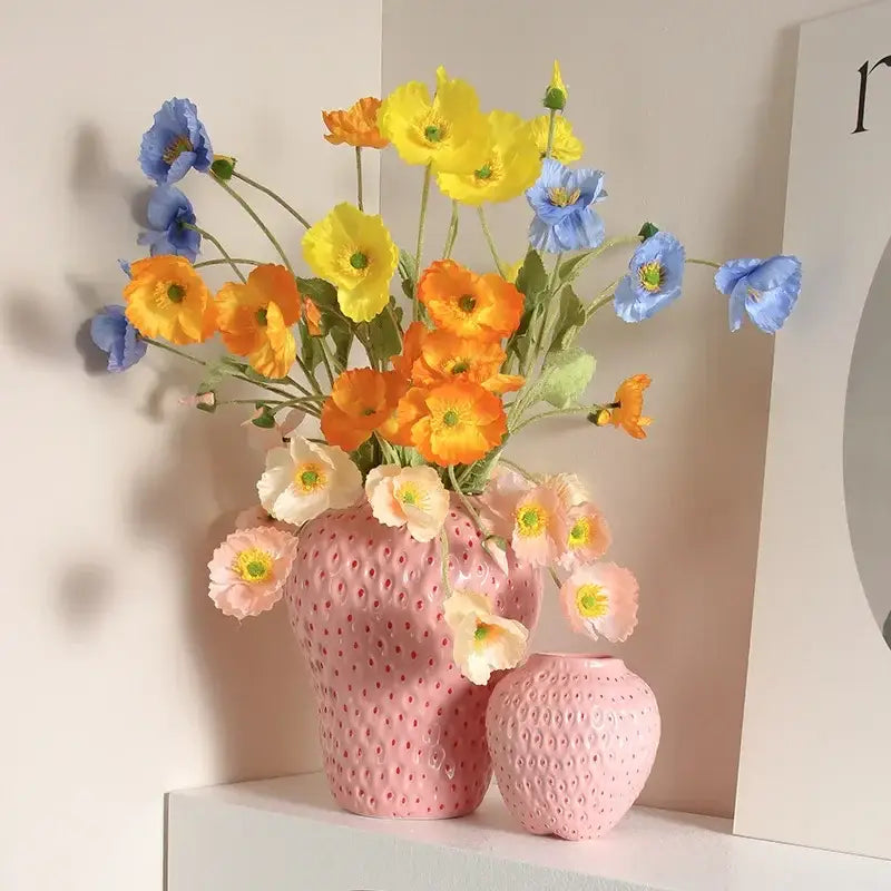 Pink strawberry cartoon flower vase made of ceramic with textured surface and dotted pattern for home décor