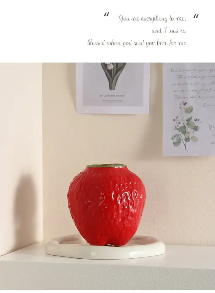 Vibrant red ceramic strawberry cartoon flower vase with glossy finish and textured surface for home décor by decorbites
