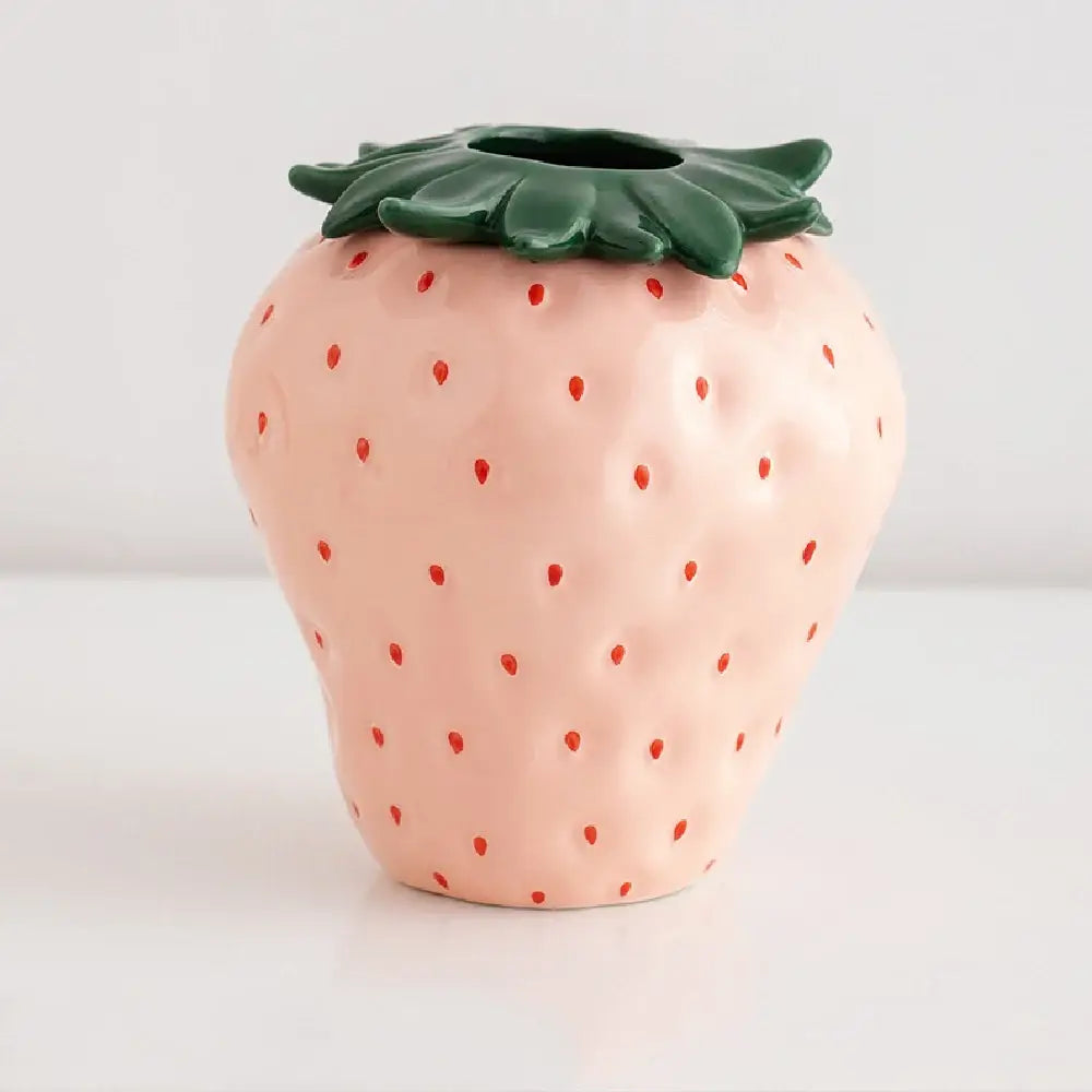 Decorbites™ pink ceramic strawberry shaped planter pot with red seed dots and green leafy top for decorative use