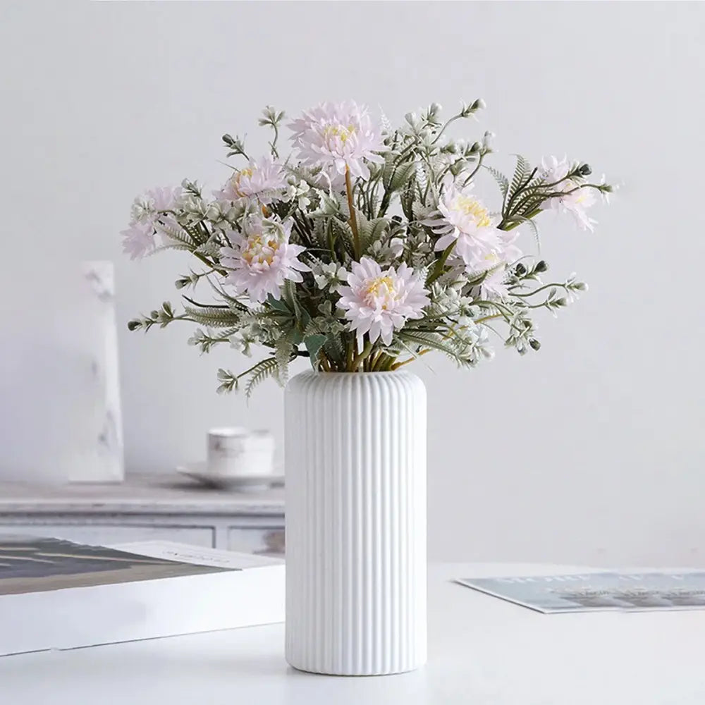 DecorBites™ striped ceramic-like plastic vase in white holds light pink and pale lavender artificial flowers