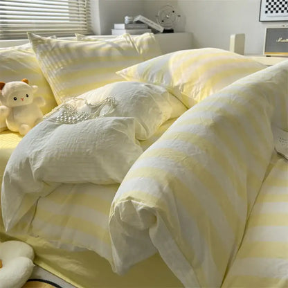 Soft yellow and white striped quilt set by decorbites with a cozy textured fabric finish and matching bed sheet