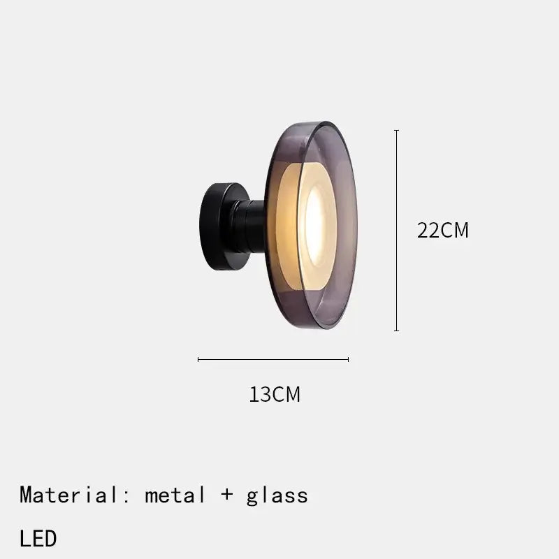 Decorbites™ stylish led wall lamp with black metal base and purple glass diffuser emitting warm ambient glow