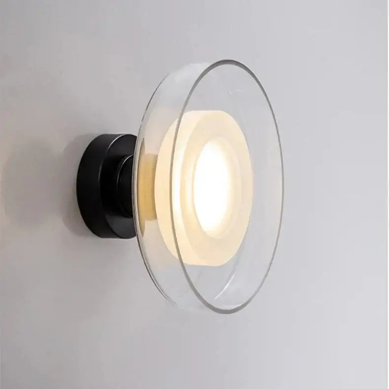 DecorBites™ stylish led wall lamp with black metal base and clear glass diffuser featuring concentric circular rings