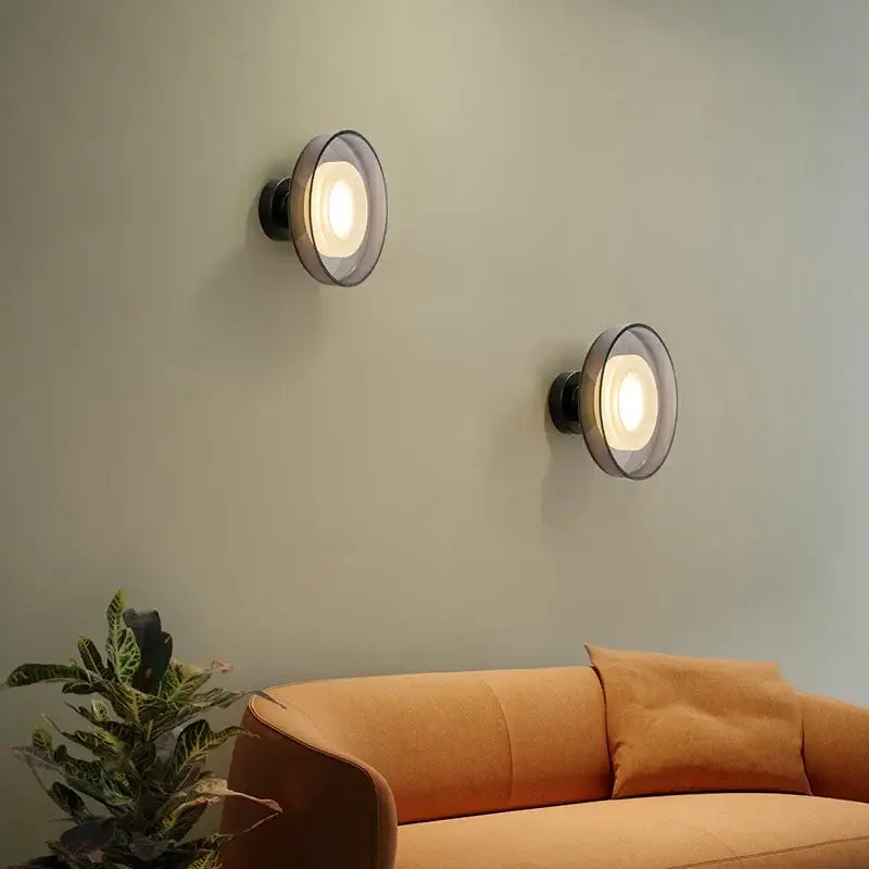 DecorBites™ stylish led wall lamp with black metal base and frosted glass shades emitting warm glow
