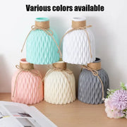 Pastel-colored ceramic stylish nordic color block vase with ribbed texture and natural twine tie for modern flower display