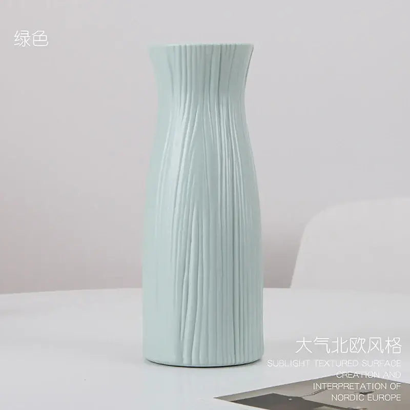 DecorBites™ stylish nordic light green ceramic flower vase with vertical ribbed texture and slender neck for home decor