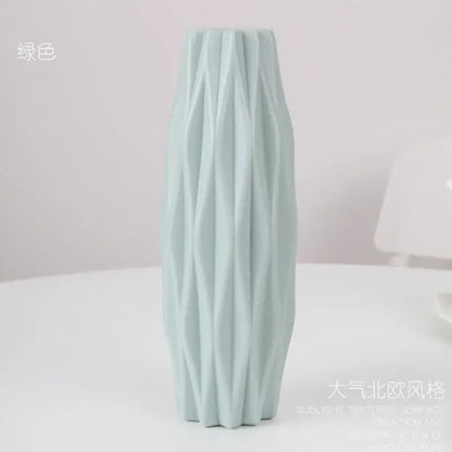 A tall light green ceramic flower vase with textured ribbed design by decorbites for home decor use