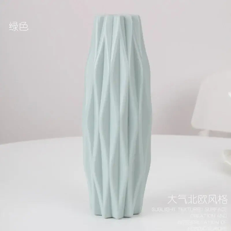 A tall light green ceramic flower vase with textured ribbed design by decorbites for home decor use