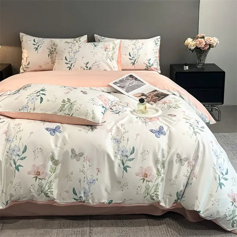 Pastel floral satin silk duvet cover set by DecorBites with butterfly prints and blush pink piping on cream base
