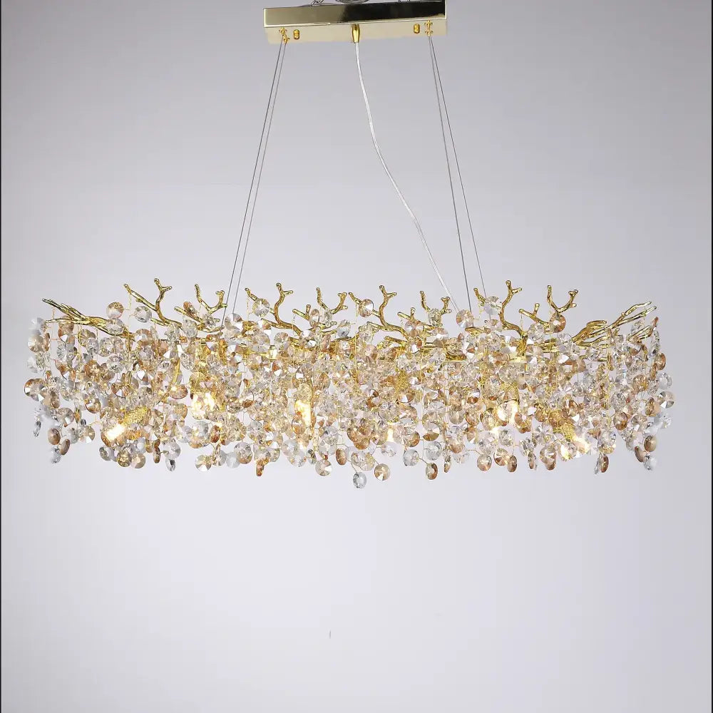 Gold-toned DecorBites sunflower crystal chandelier with intricate branch design and cascading crystals for dining room