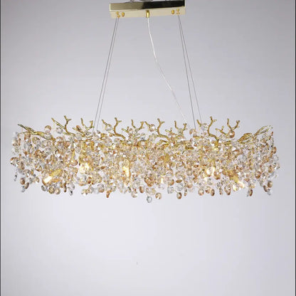 Gold-toned DecorBites sunflower crystal chandelier with intricate branch design and cascading crystals for dining room