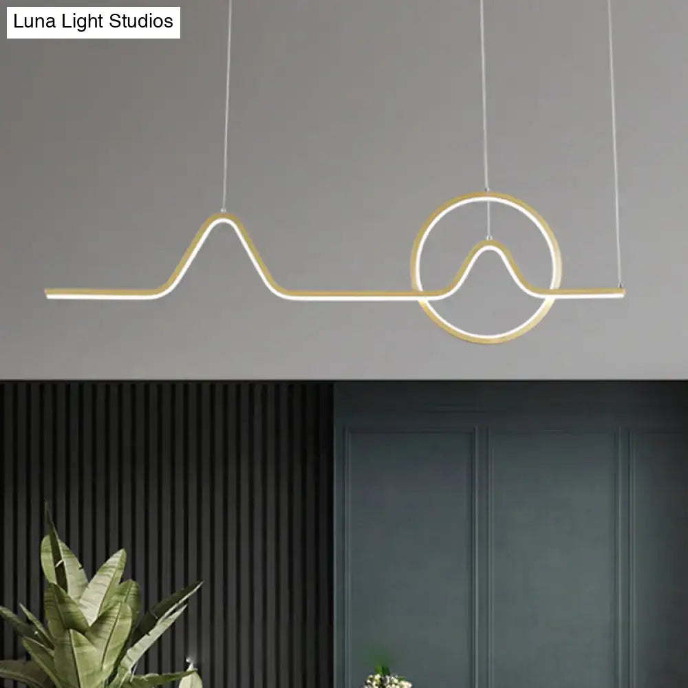 Modern gold-toned led pendant island light with sleek abstract wave and circular design for warm white third gear ambiance