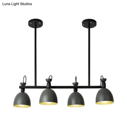Black industrial-style pendant light fixture with four dome shades emitting warm glow 110v-120v light type for dining room