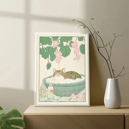 Decorbites™ tabby cat wall art featuring a japanese tabby cat lounging in a green basin with pink blossoms