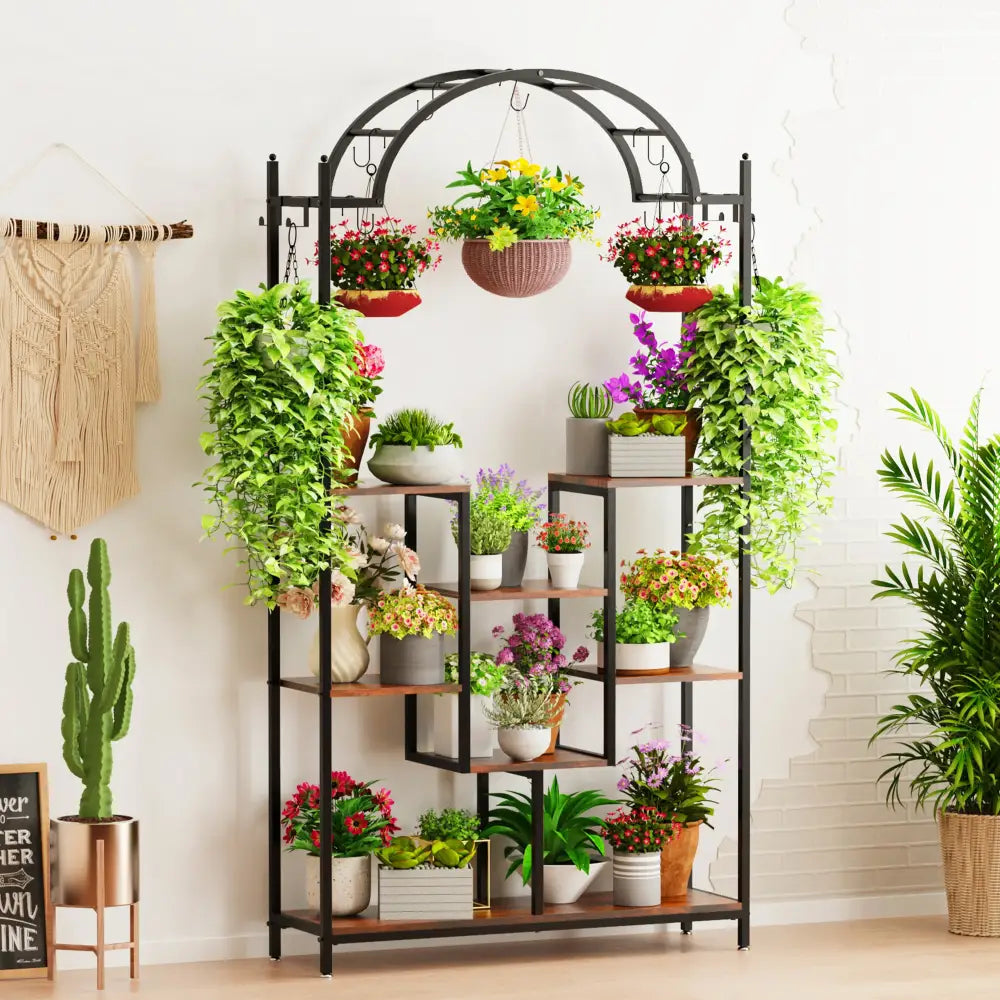 Black metal and wood plant stand with arched top, 5 tiers, and hanging hooks serving as a versatile plant holder