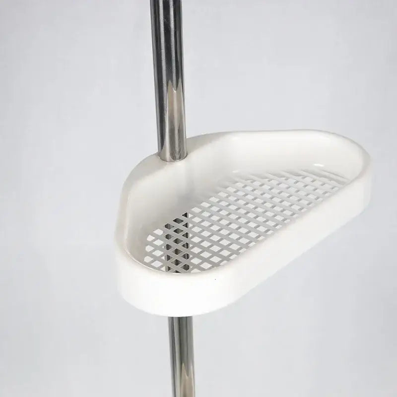 White plastic shower caddy with grid pattern mounted on chrome stainless steel telescopic shower rack organizer
