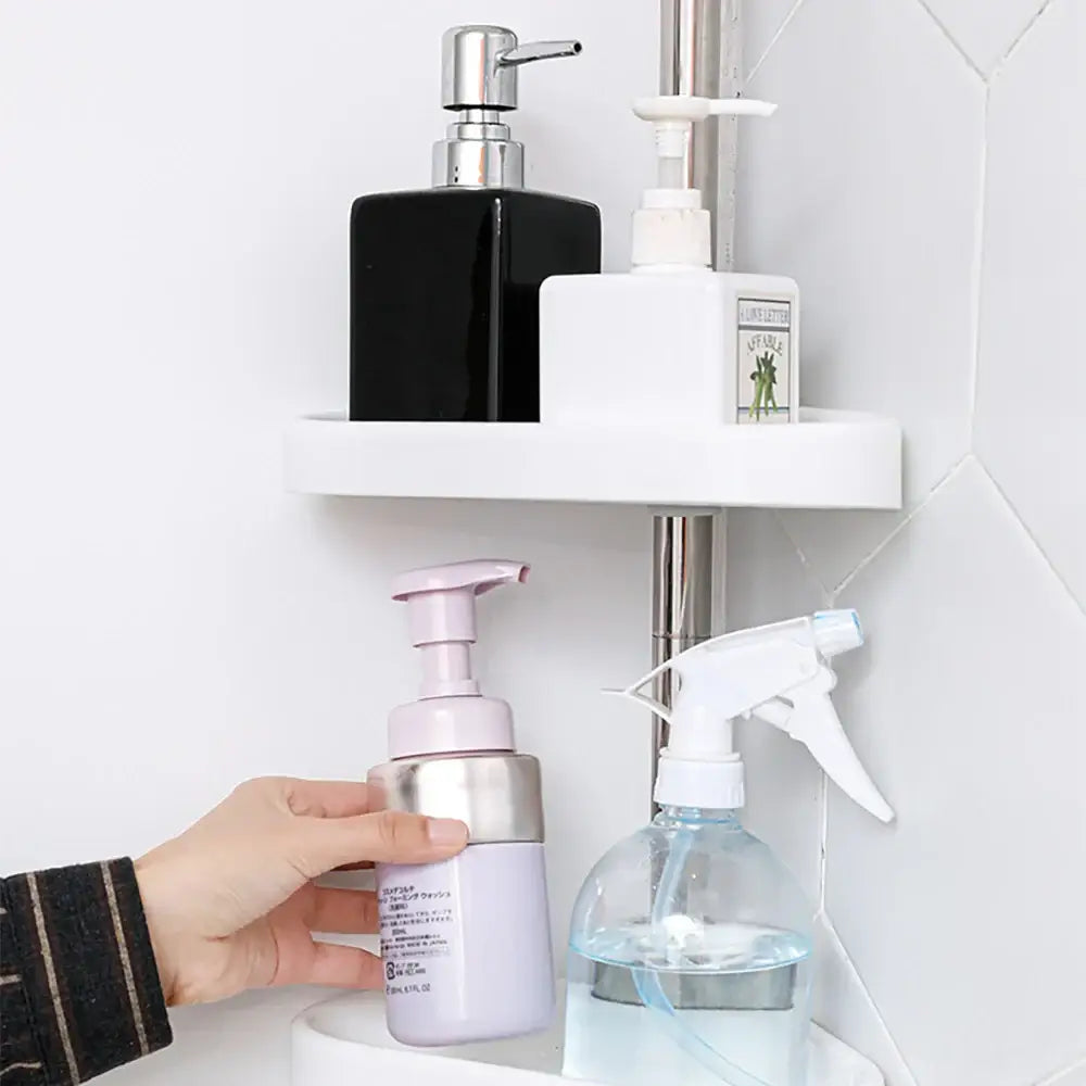 White plastic corner shelf with two tiers holding bathroom products in decorbites™ rust-proof stainless steel telescopic shower rack organizer