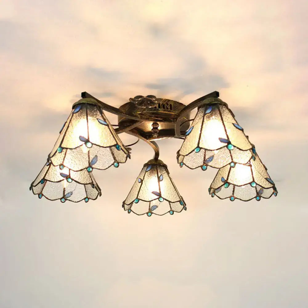 Vintage-style decorbites tiffany stained glass ceiling light in antique bronze with three scalloped turquoise leaf shades