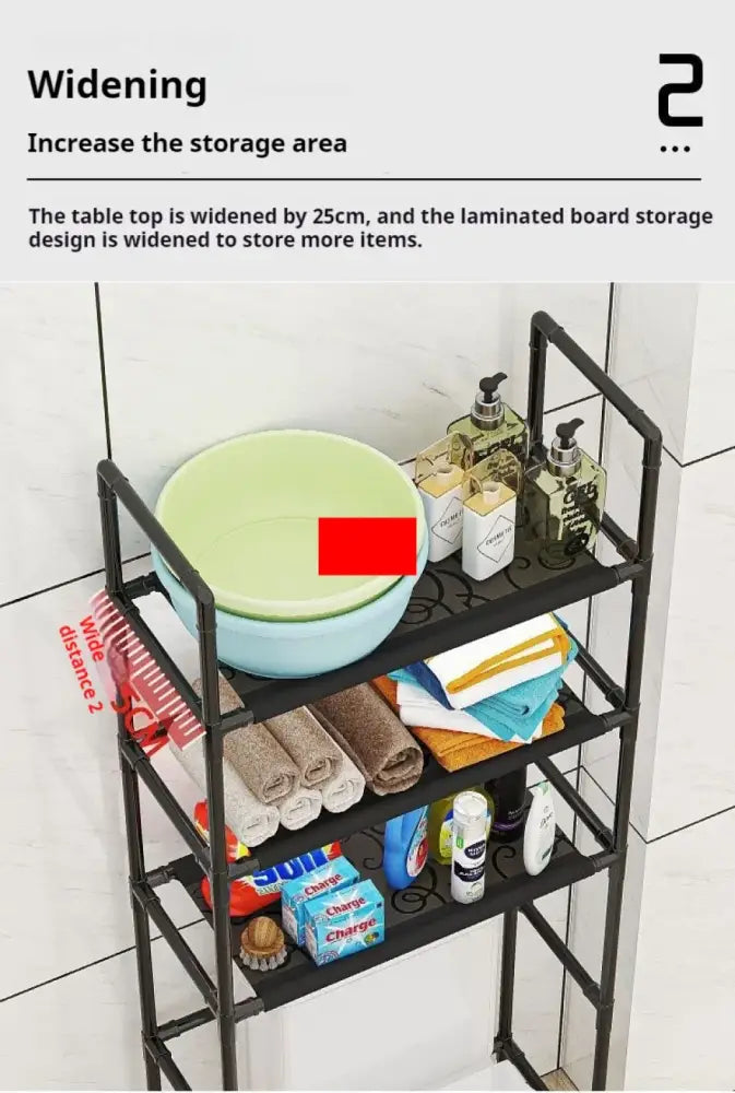 Black metal three-tier DecorBites™ bathroom storage rack with decorative scrollwork and widened top shelf for toilet storage