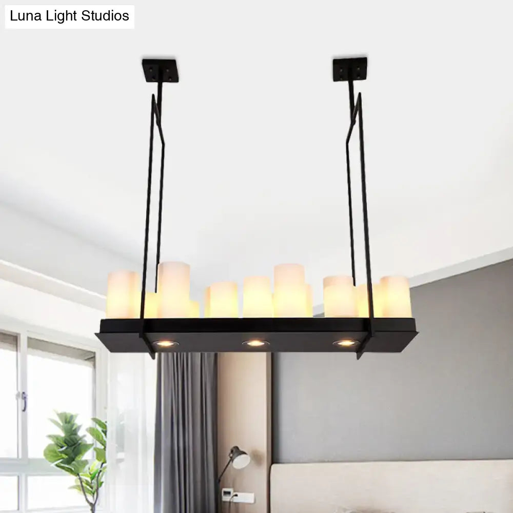 Black metal island pendant light with barrel frosted glass and warm candle-style bulbs for dining room lighting