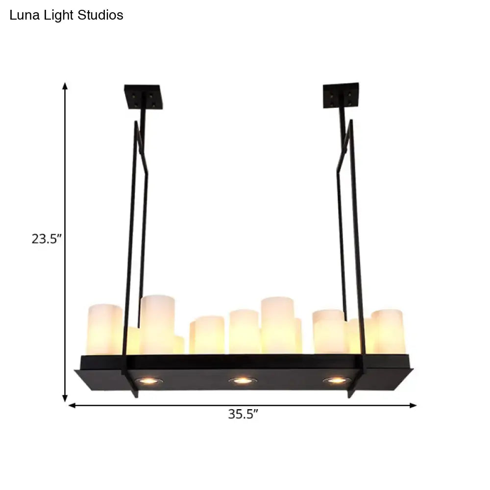Black metal island pendant light with multiple warm-toned candle-style bulbs and traditional barrel frosted glass shades