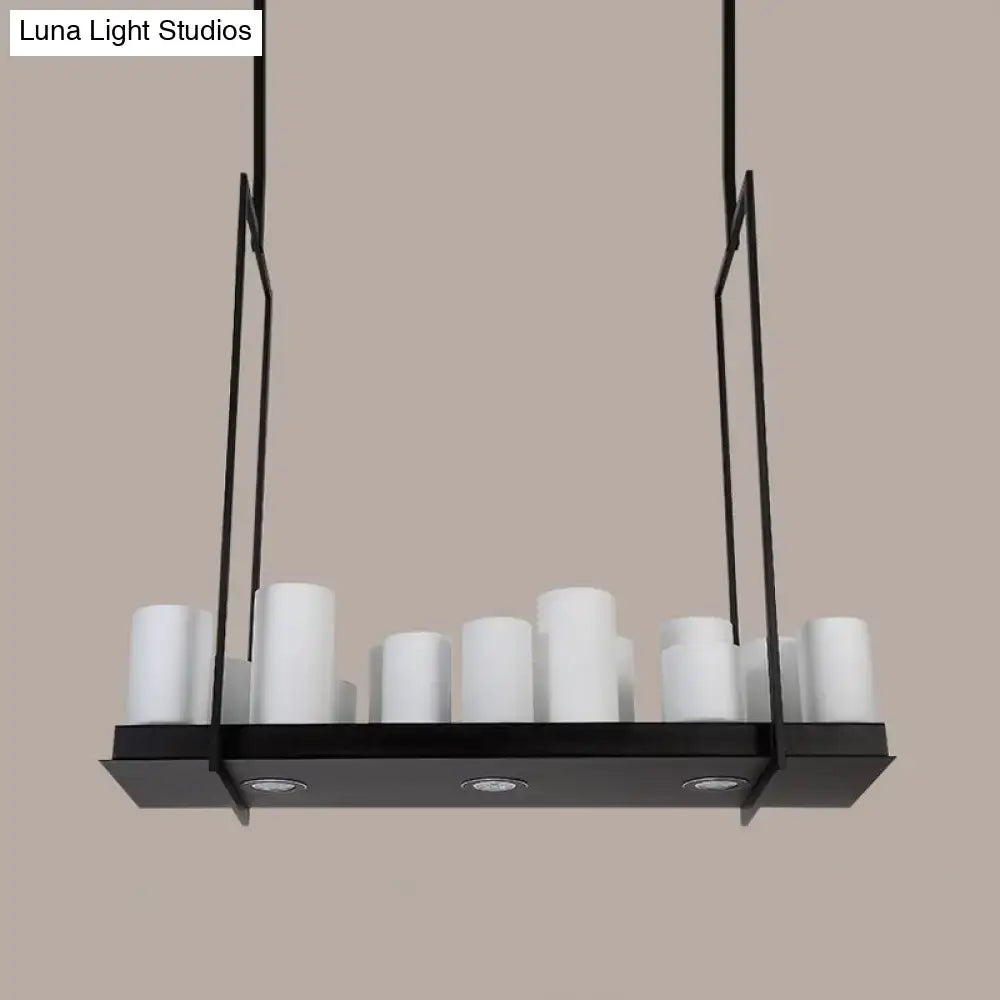 Modern black metal island pendant light with traditional barrel frosted glass cylindrical shades and recessed lighting