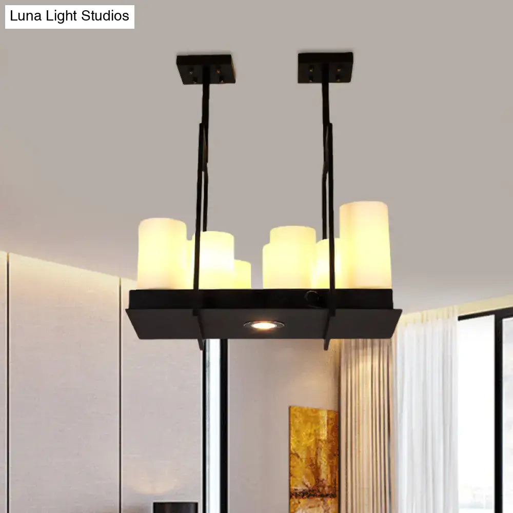 Black metal island pendant light with six warm-toned traditional barrel frosted glass shades for dining room