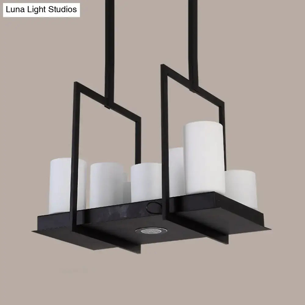 Modern black metal island pendant light with six barrel frosted glass shades designed for dining room use
