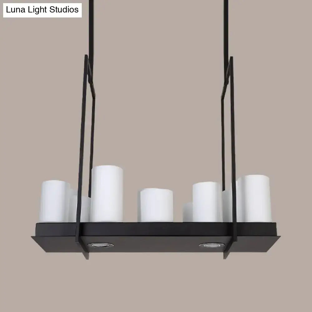 Black metal island pendant light with five white traditional barrel frosted glass shades for dining room use