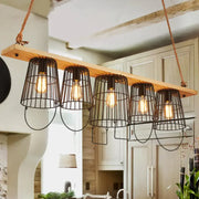 DecorBites traditional barrel metal island pendant light with five black wire cage shades and wood accents for dining room
