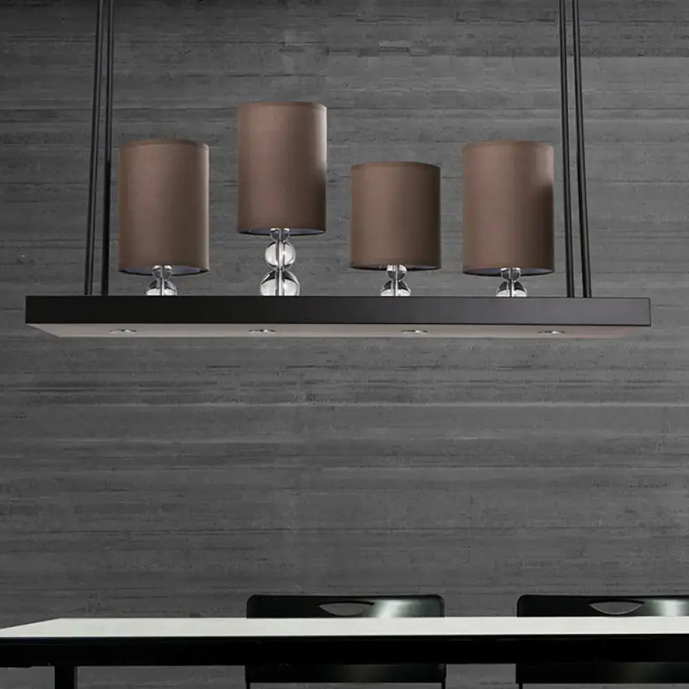 DecorBites traditional black cylinder island light fixture with four brown fabric shades and clear glass accents