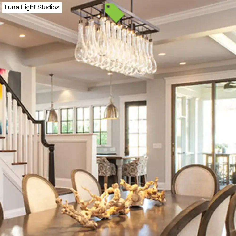DecorBites traditional black island pendant light with black metal frame and three clear glass rectangles warm white light