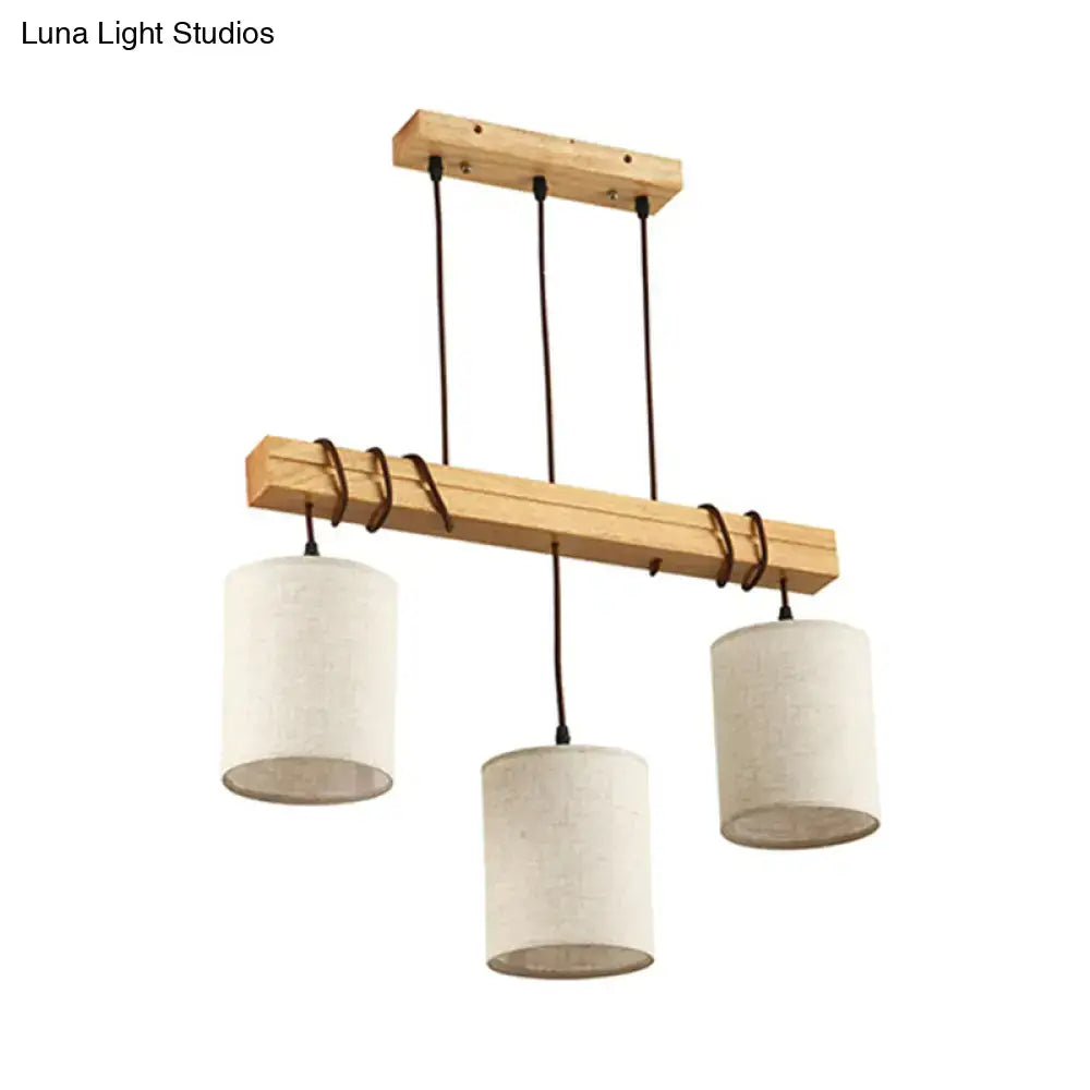 Minimalist wooden chandelier with three off-white fabric shades and black cords for dining room e26 e27 fixture width
